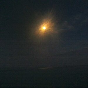 Moon over Lake Erie opposite Sunrising Aug 13 2022.jpg