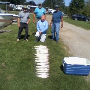 L to R Hooked on Ice, Capt Tom in the back Taper kneeling and Kevin and the 24 fish we brought...jpg